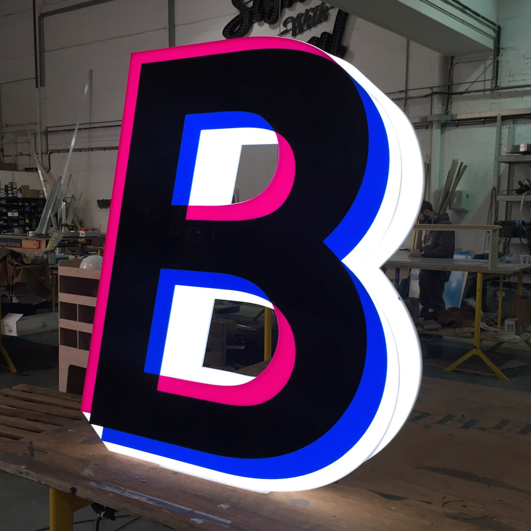 Illuminated acrylic letter B