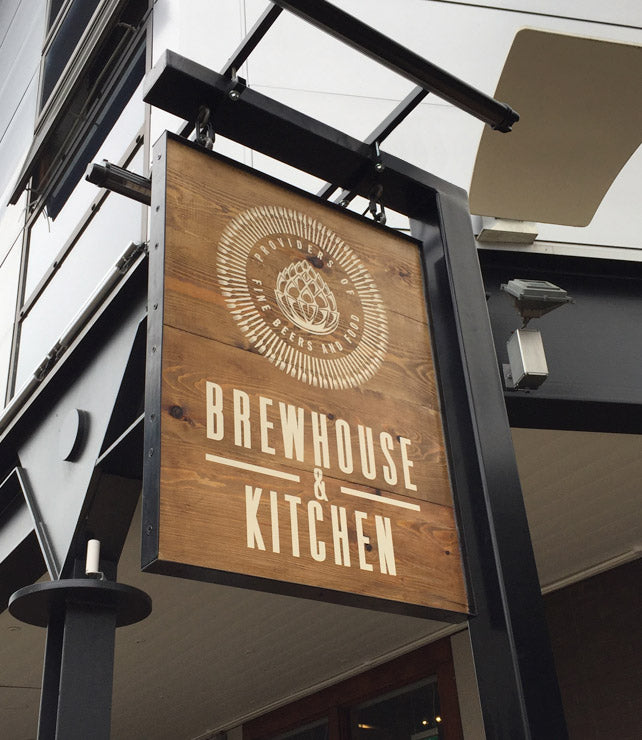 Timber projecting sign on post