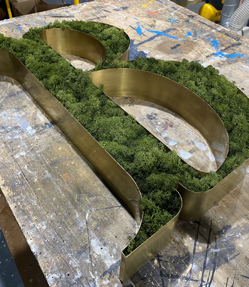 Antique brass letter with moss – Brass Signs by Goodwin & Goodwin, London