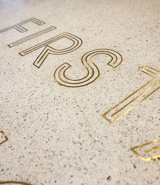 Brass letters embedded in concrete – Brass Signs by Goodwin & Goodwin, London