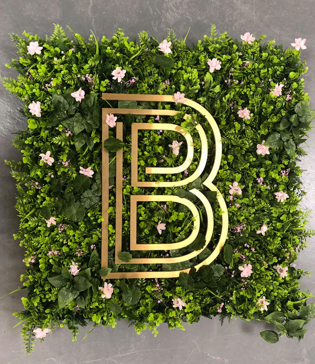 Solid brass letter on living wall – Brass Signs by Goodwin & Goodwin, London