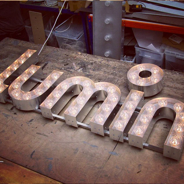 Light letters on bars Light letters on bars – Light Up Letters by Goodwin & Goodwin, London