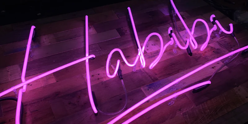 Neon Sign on reclaimed wood Neon Sign on reclaimed wood – Real Glass Neon Signs by Goodwin & Goodwin, London