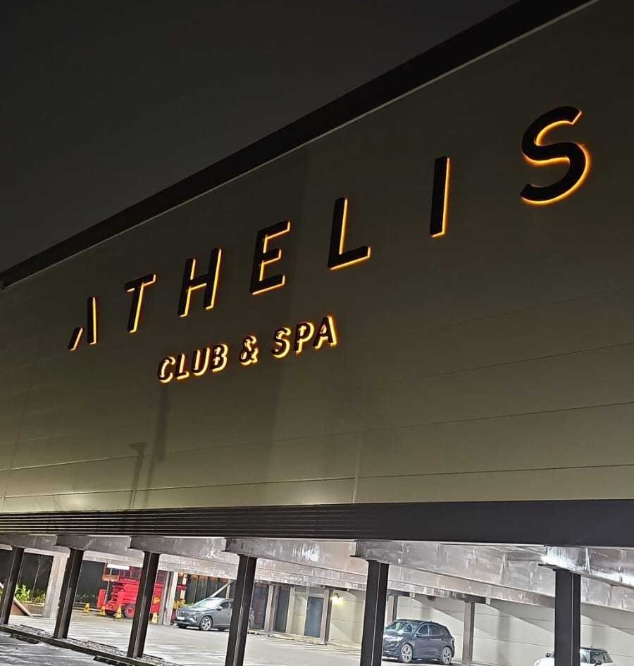 Illuminated sign lettering installed and lit — Goodwin & Goodwin, London
