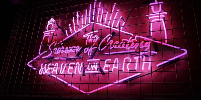 Neon sign in cage – Restaurant Signs by Goodwin & Goodwin, London